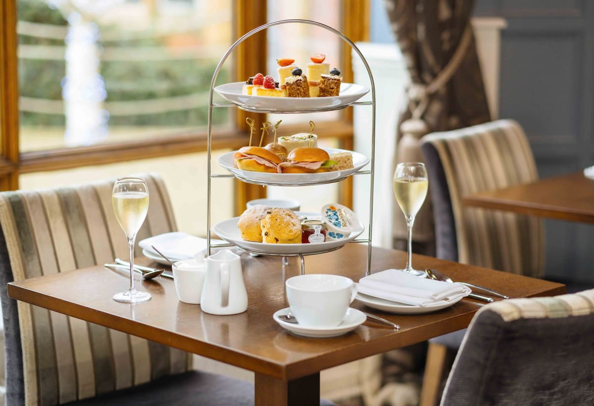 Afternoon tea stand with champagne